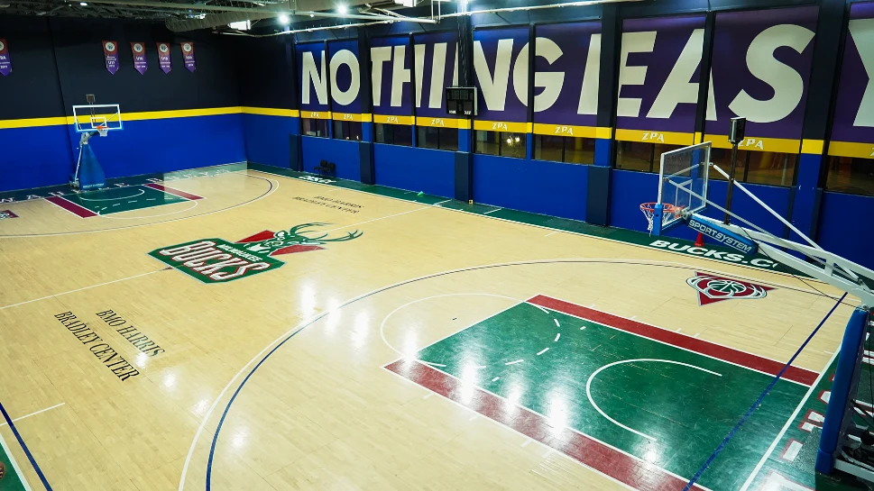 An indoor basketball court shown in the supplied academy programme